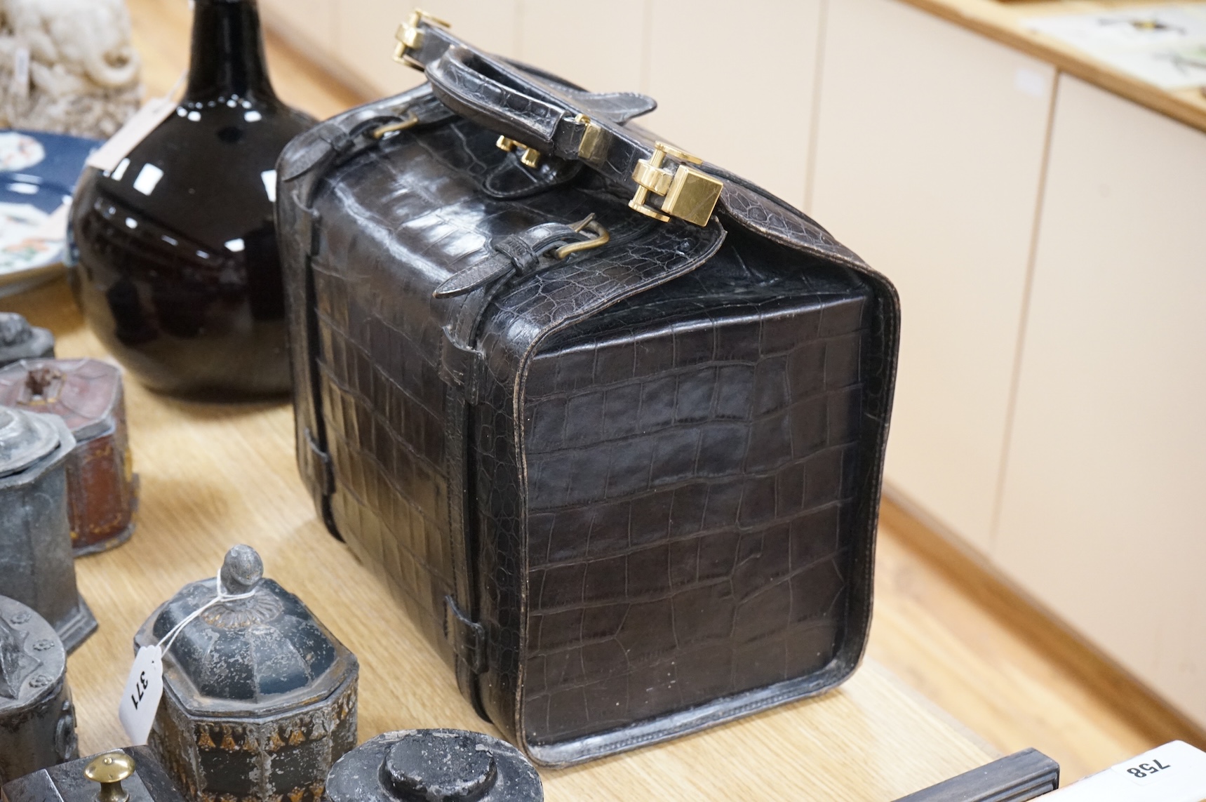 A 1940’s ladies crocodile skin Gladstone bag with gilt metal hardware, 34cm wide